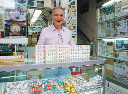 Artisan keeps his craft alive with each carved mahjong tile